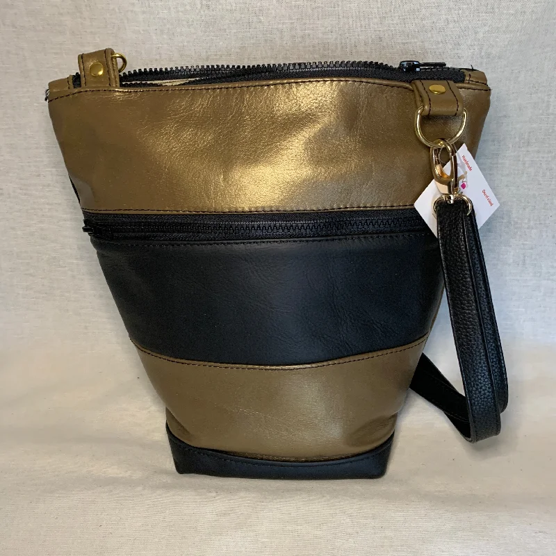 Exclusive Designer Style Deals Beautiful  black and gold all leather bag with adjustable crossbody strap.