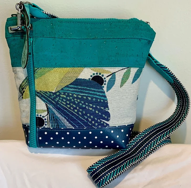 Designer Bags For Luxury Collectors Bright, colorful, unique small crossbody in shades of teal, turquoise and blue.