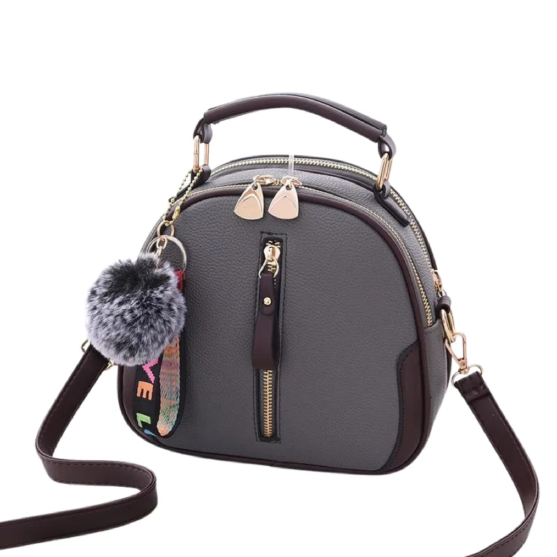 Break Fashion Norms Chic Black Round Tote with Fur Charm