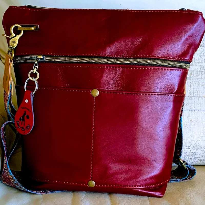 Lightweight Bags For Senior Travelers Beautiful reddish/merlot leather midsize crossbody with pockets galore