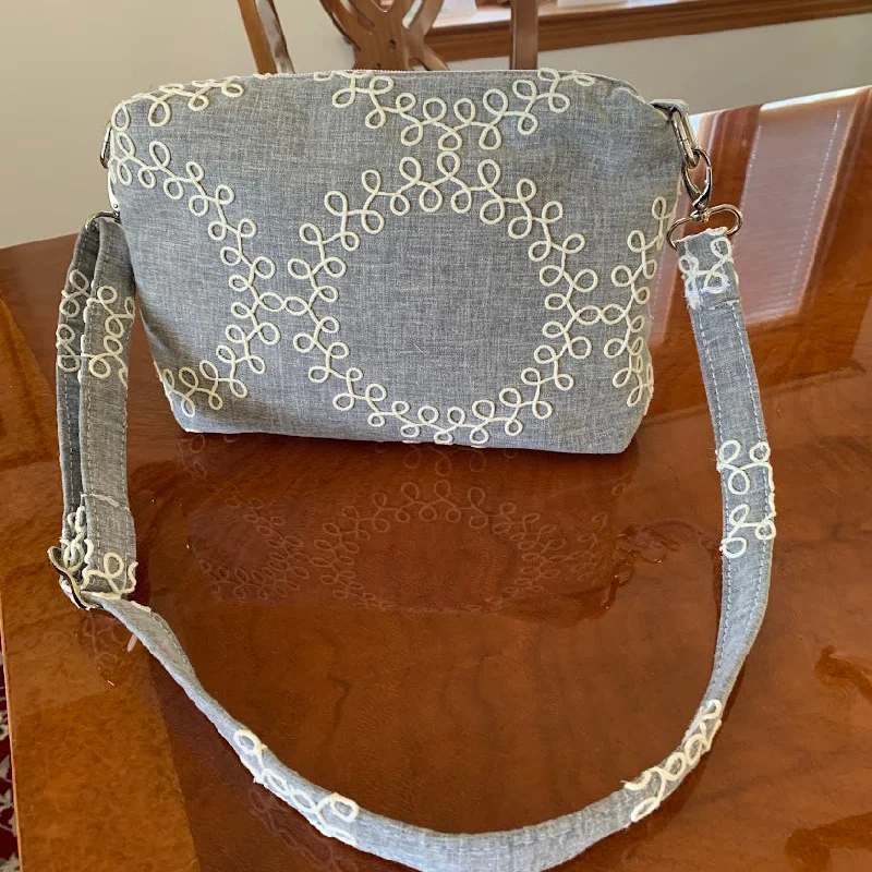 Inspired Bags For Luxury Fashion Lovers New Item! Distinctive gray and white fabric crossbody with quality nickel hardware.