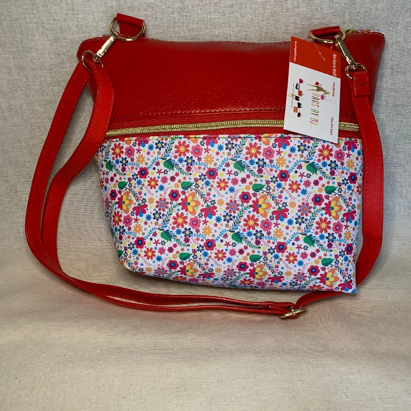 Cozy Chic Promotions Colorful vinyl crossbody with two large exterior zipper pockets.