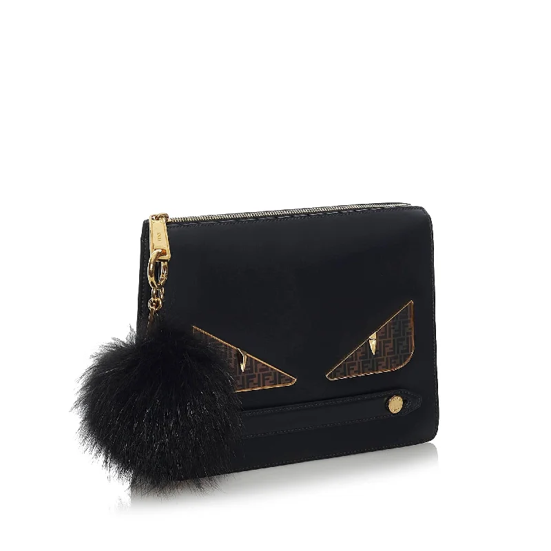 Minimalist Bags For Clean And Modern Aesthetics Fendi Monster Leather Clutch Bag (SHG-33968)